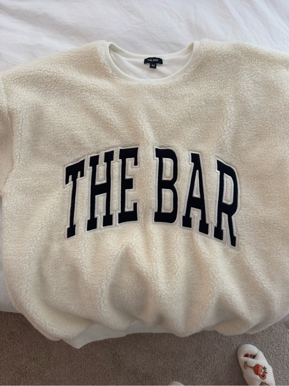 The Bar Cream Sherpa Crewneck with Black Appliqué